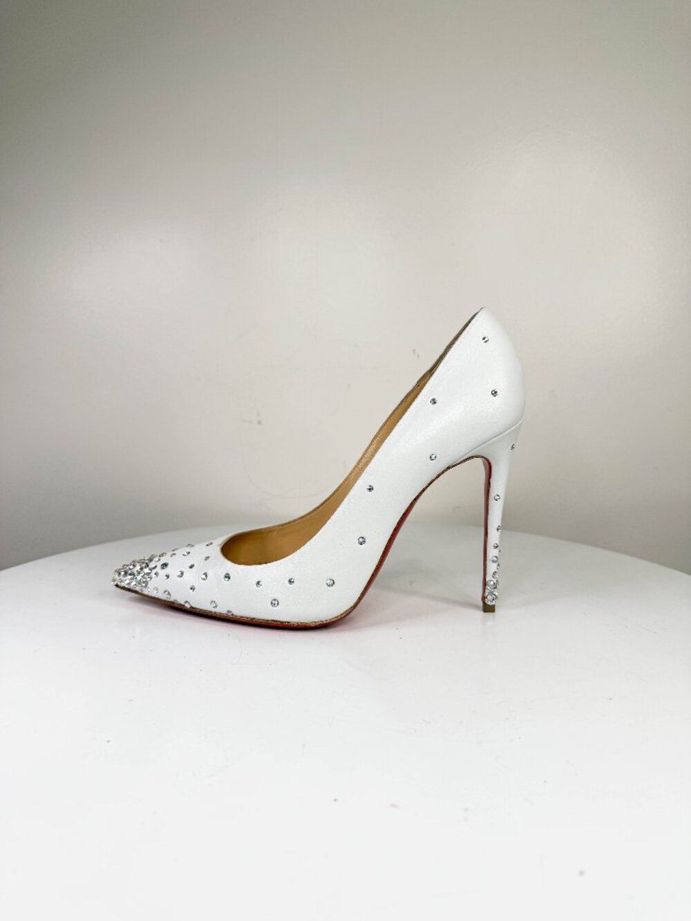 Louboutin Degrastrass white leather heels with crystals